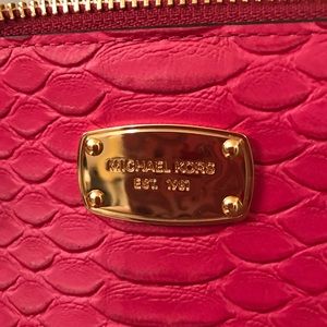 Large pink Michael Kors wristlet.